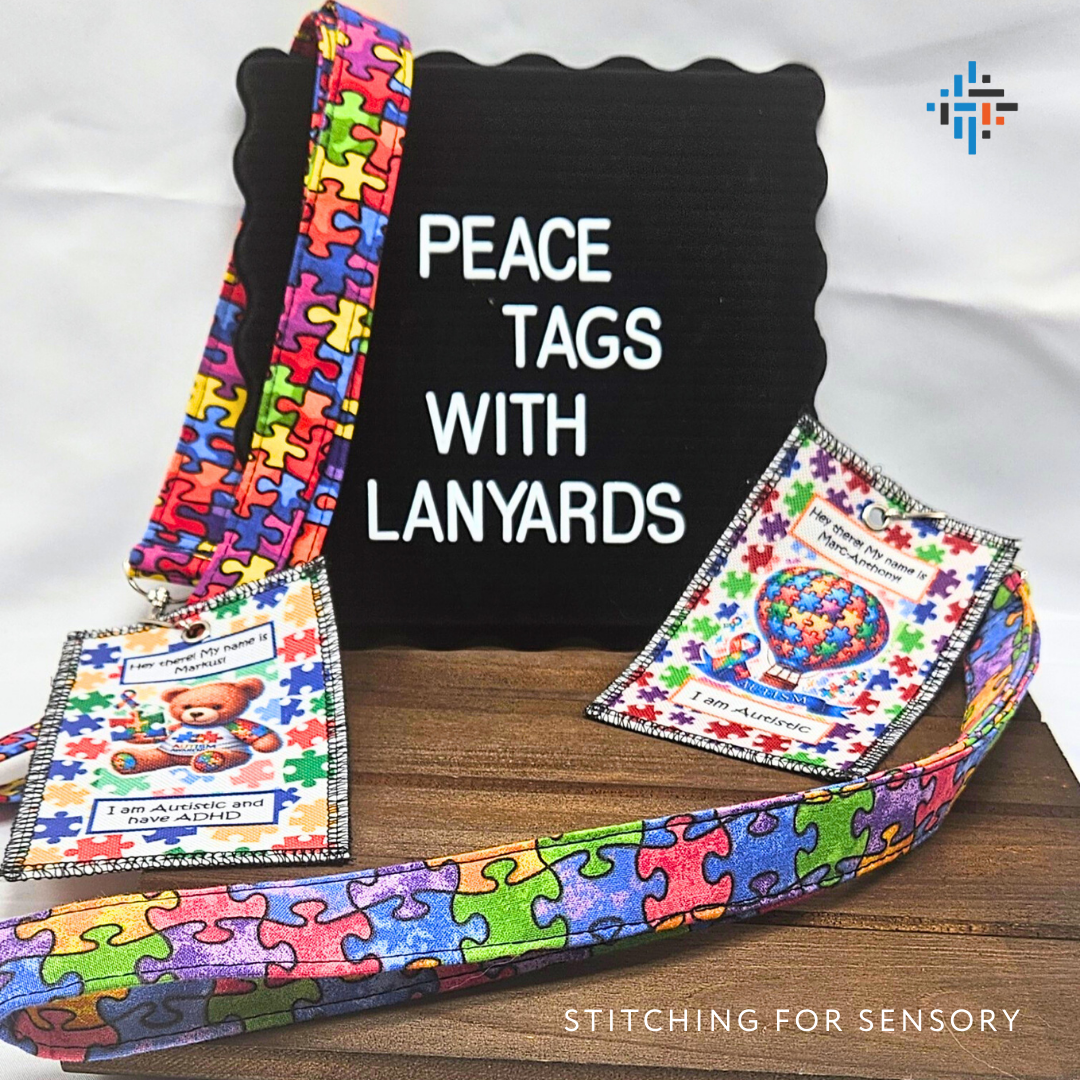 Handmade Peace Tags™ with autism puzzle piece lanyards displayed on a board – safe ID tags for children and adults by Stitching for Sensory.